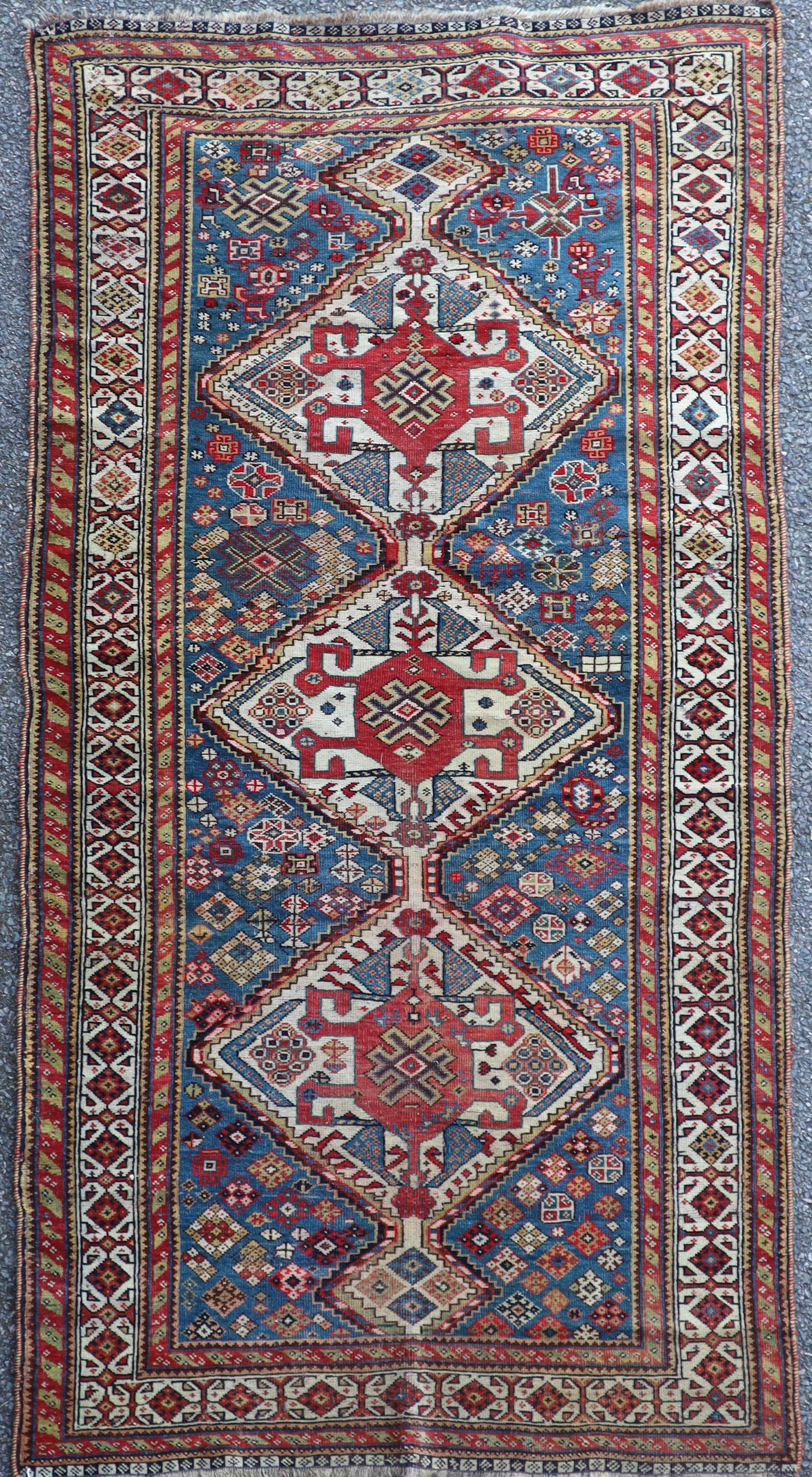 An antique Qashqai blue ground rug 184 x 95cm